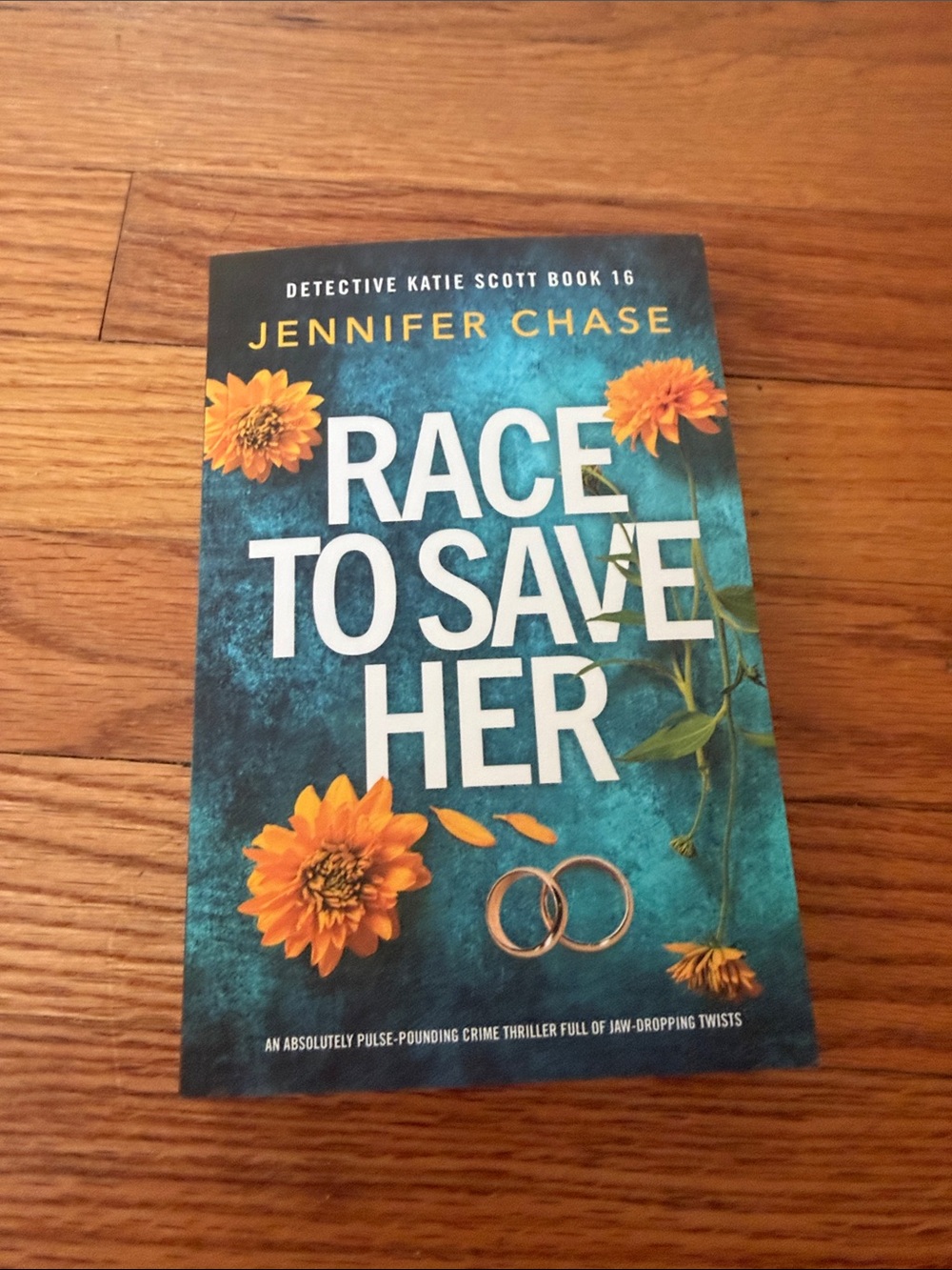 Race to Save Her - a novel by Jennifer Chase - Teal Cover with Orange Flowers